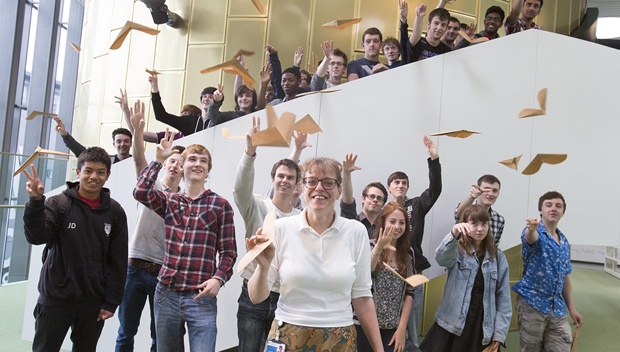 Students throwing Paper Planes